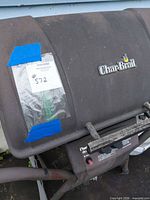 Exterior view of closed grill showing logo and overall wear