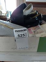 Box containing two pairs tap shoes, white-black and black, plus other accessories