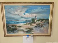 Full view of framed seascape painting