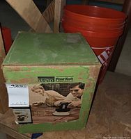 Front and top of green Powr Kraft Montgomery Ward orbital polisher buffer box