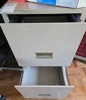 Cabinet front showing both drawers open