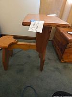 vintage child-size wooden school desk with attached seat shown from side angle