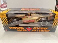 Front view of boxed MotoMaster friction racer