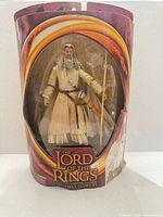 Front view of sealed Gandalf the White figure in packaging