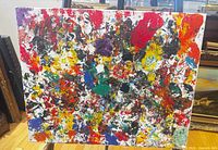 Full front view of abstract expressionist painting on easel
