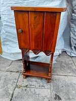 Full view of mahogany smoking stand cabinet front and side