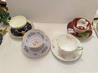 Group shot of four teacup and saucer sets