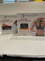 Both sealed boxes showing front panels and product variants