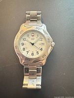 Front view of Victorinox Swiss Army watch showing full bracelet