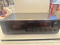 Front view of Denon DRM-650S cassette deck showing full control panel and chassis