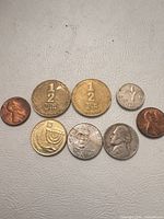 All eight coins laid out
