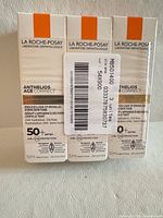 Front view of three sealed boxes showing brand, product name, SPF rating and size