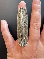 Front view of ring worn on finger showing marcasite rows