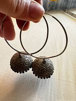 Front view of both sterling silver jhumka hoop earrings showing overall design and size