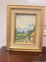 Front view of framed landscape painting