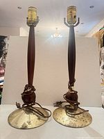full view of both matching table lamps showing wood stems, brass bases and sockets