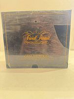 Front of Trivial Pursuit Genus Edition subsidiary card set box showing logo and partial shrink wrap