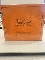 Front of sealed orange Genus II Edition box