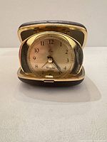 Front view of clock open showing dial and case