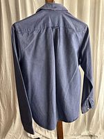 Back view of navy J.Crew oxford shirt showing overall fabric and condition