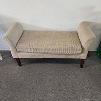 Front view of beige woven-fabric chaise lounge with wood legs