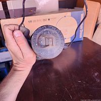 Top view showing embossed fuel cap and folding bail handle