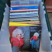 Stack of LPs in tote, Dolly Parton album at front