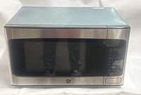 Front view of GE stainless steel countertop microwave