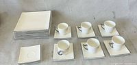 Full set showing stacked plates, saucers and six cups