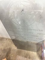 Front view of etched glass panel showing logo and years