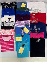 All 20 folded tops laid out in five rows of four