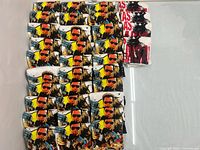 Grid of folded Terminator shirts with small stack of Chainsaw shirts