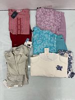 Overview of all folded outfits on table