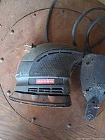 Left side view showing Craftsman logo, power cord and main body.