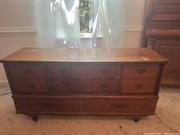Front view showing eight drawers and pulls