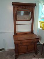 Full view of dresser with attached mirror