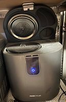 Front view of FoodCycler with lid closed, power button illuminated