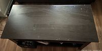 Top view of coffee table surface displaying finish and wear