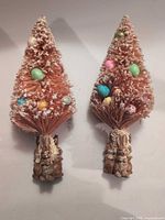 Full view of both bottle brush trees showing color, eggs, flocking, and rabbit bases