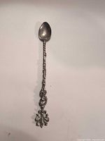 Full view of ornate pewter spoon
