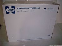Front of Sealy warming mattress pad retail box showing branding and twin size