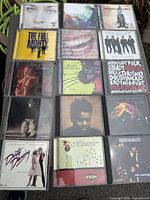 Front view showing 16 of the CD album covers