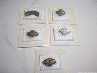 Five Harley-Davidson H.O.G. lapel pins dated 1995-1999 on display cards