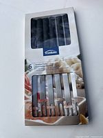 Front of sealed Trudeau Domino Forks box showing six forks through window