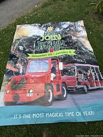Full banner laid out on grass showing complete graphics and overall condition