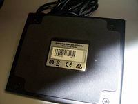 Underside of footswitch showing manufacturer label and screws