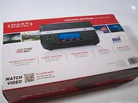 Front of retail box showing Maxx Digital Automatic Alert Radio with Alarm Clock