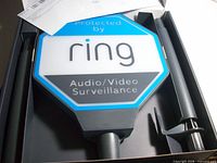 Ring solar security sign kit inside box showing sign and stake components