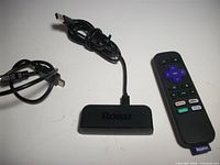 Roku streaming device, USB power cable, HDMI cable, remote displayed
