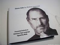 Front of case showing Steve Jobs portrait and ASL presentation note